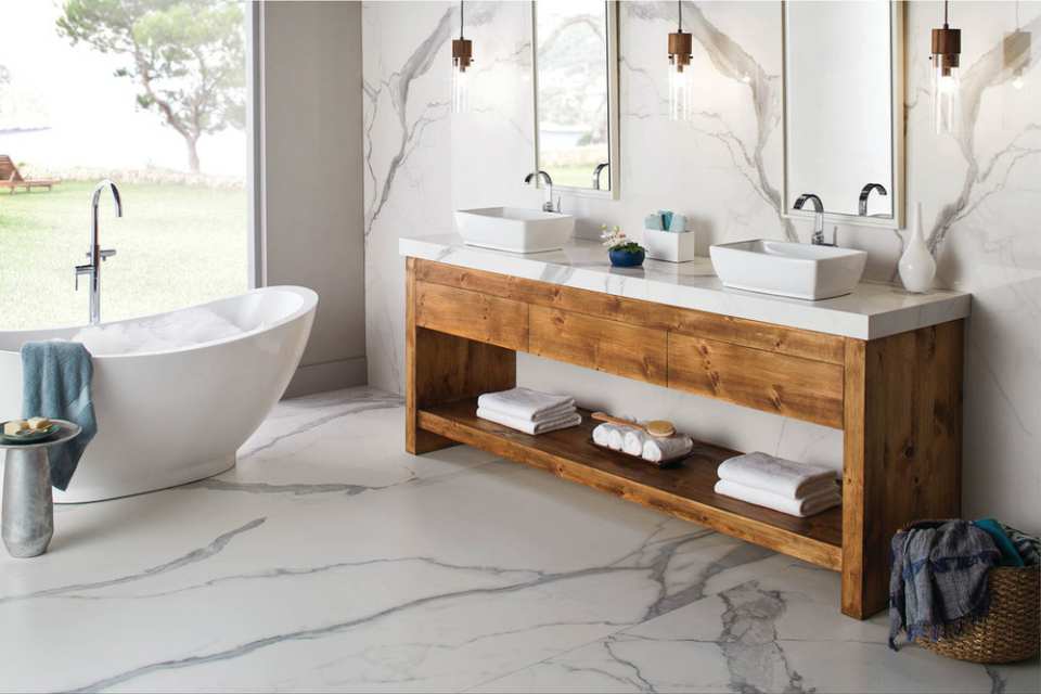 marble look porcelain tile flooring in modern bathroom with deep soak tub